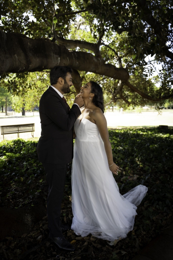 Couple sharing a champagne toast outside Perth Marriage Office